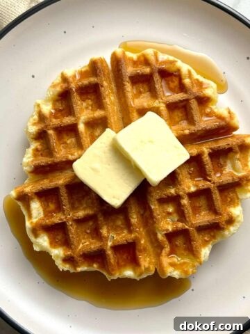 mochi waffle on plate with butter and syrup
