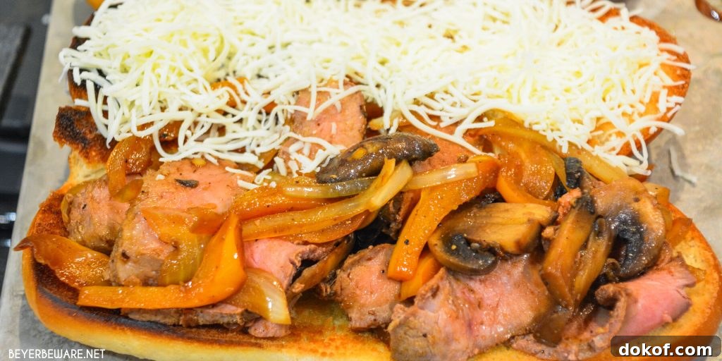 Leftover steak sandwiches uses up cooked steaks to create a midwest version of a Philly Cheesesteak sandwich with caramelized mushrooms, onions and peppers.