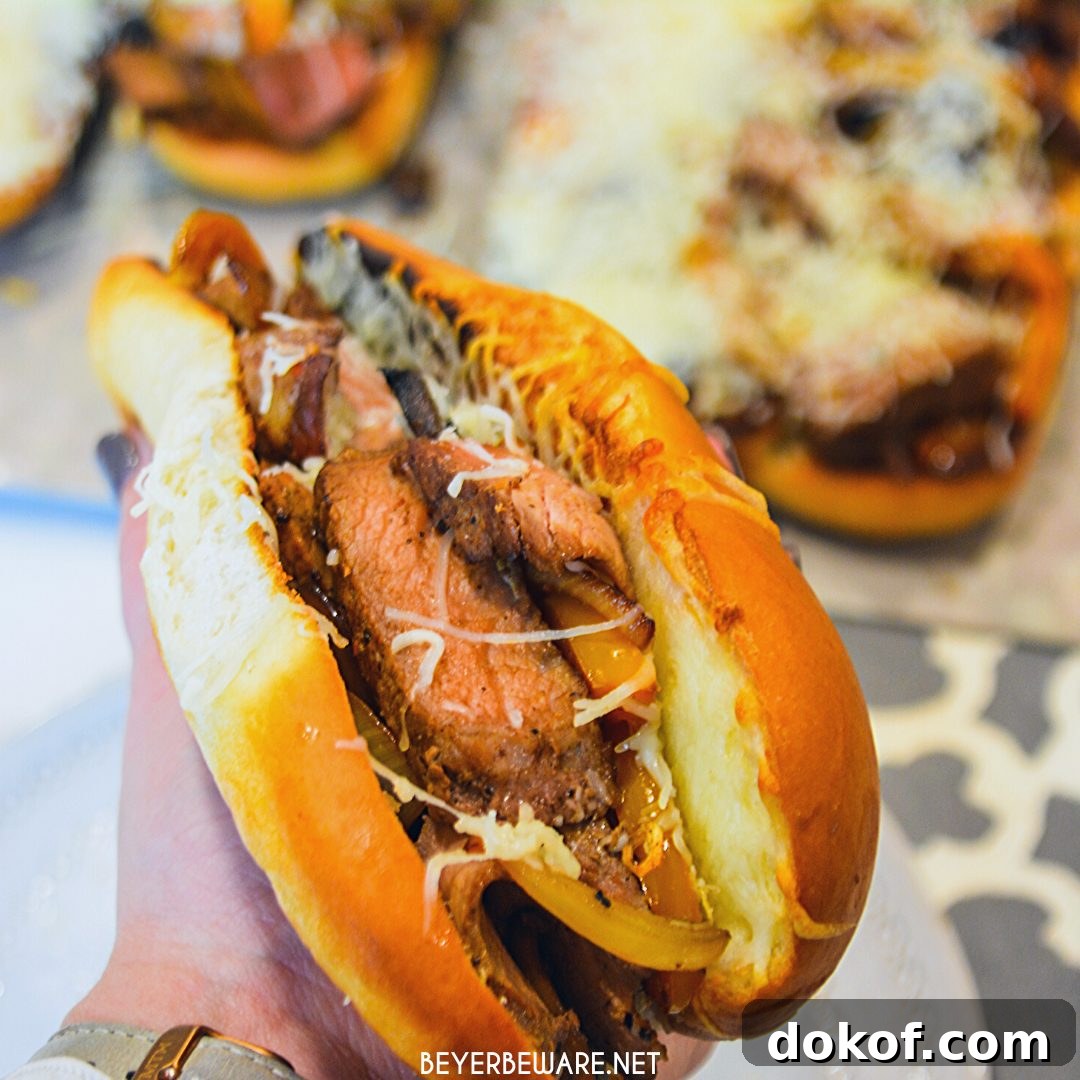 Leftover steak sandwiches use up cooked steaks to create a midwest version of a Philly Cheesesteak sandwich with caramelized mushrooms, onions, and peppers.