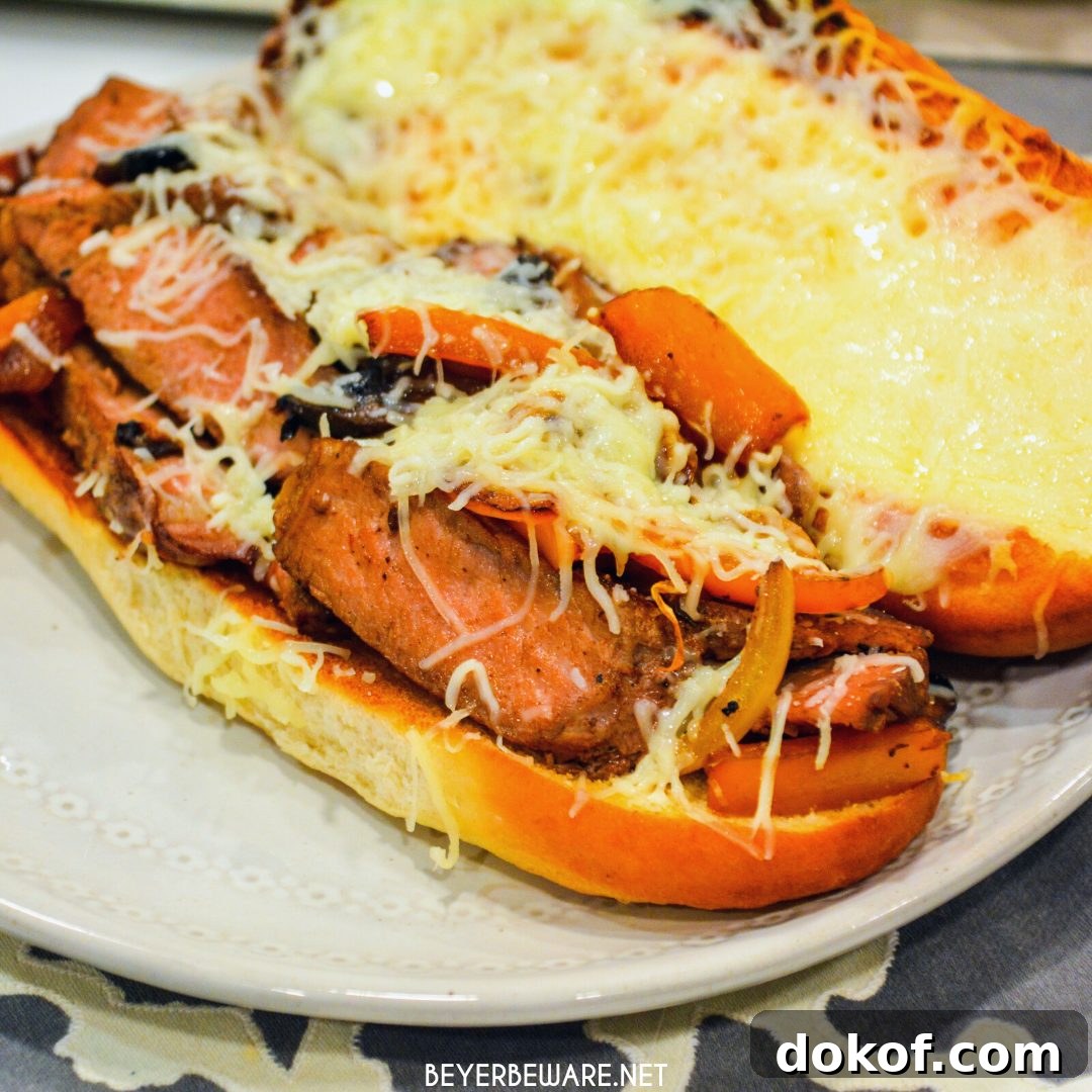 Leftover steak sandwiches uses up cooked steaks to create a midwest version of a Philly Cheesesteak sandwich with caramelized onions and peppers.