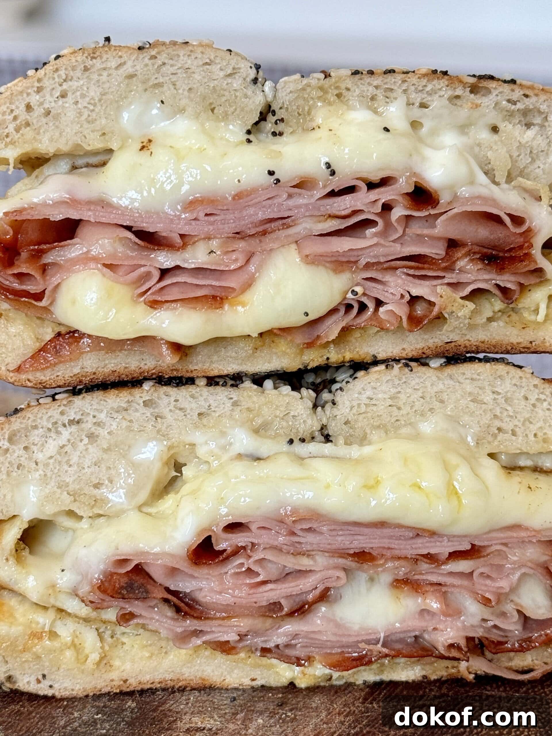 Morning Bagel Sandwich Recipes for Quick, Flavorful Breakfasts 3 breakfast bagels sandwiches stacked up.
