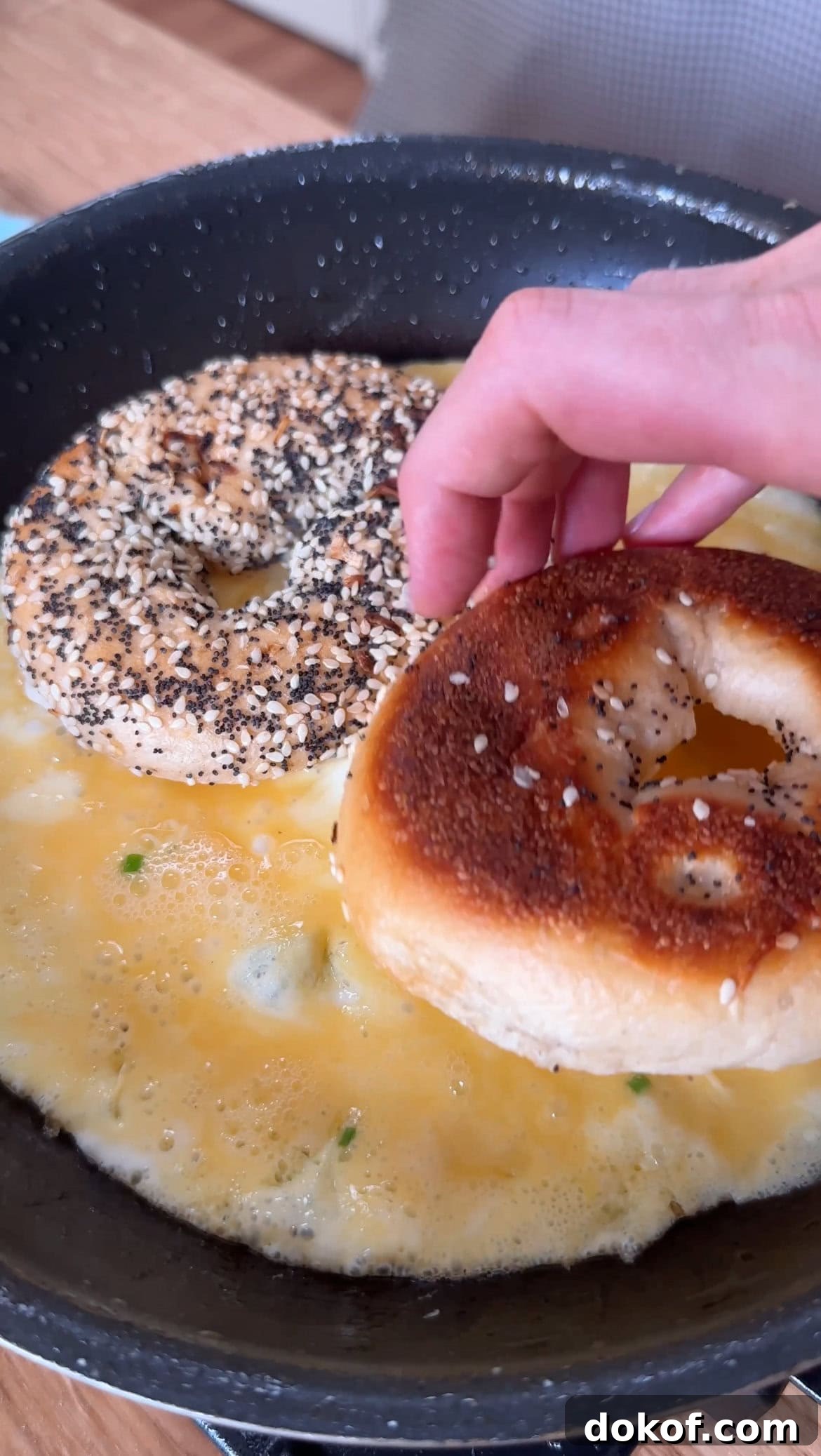 Morning Bagel Sandwich Recipes for Quick, Flavorful Breakfasts 6 adding bagel halves to the egg.