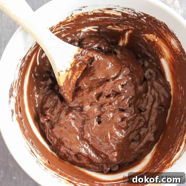 batter in bowl with wooden spoon