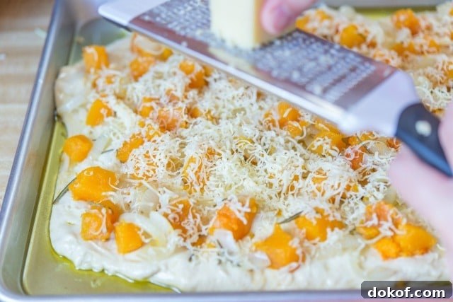 Grating Cheese on Top of Butternut Squash Focaccia
