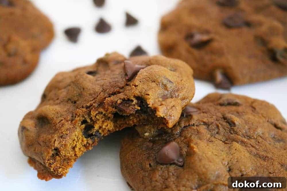 pumpkin chocolate chip cookies on cutting board.