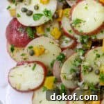 Close up of Herbed Potato Salad with Capers and Pickled Golden Beets.