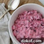 Swedish Beet Salad in a bowl with a spoon.