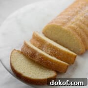 Sliced Swedish Almond Cake on a marble plate