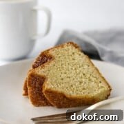Slice of bundt cake on a plate with a fork.