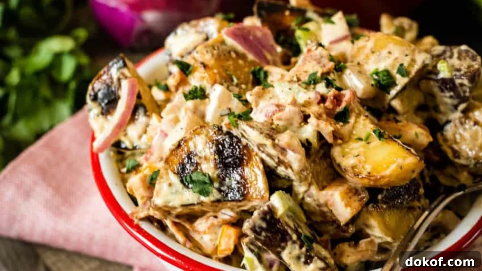 Smoked potato salad with tender potatoes coated in a smoky, savory dressing.